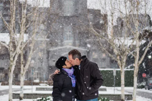 John and Elsa sharing a kiss in the snow
