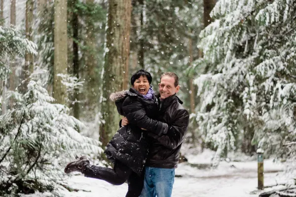 John and Elsa in a snowy forest