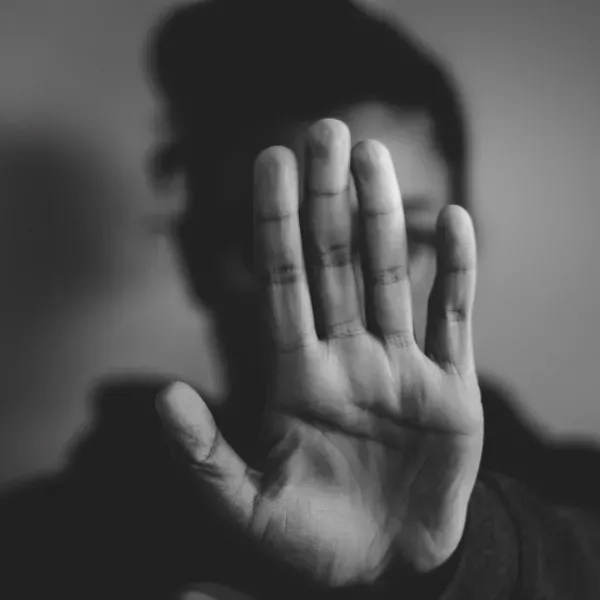 grey close-up photography of person lifting hands